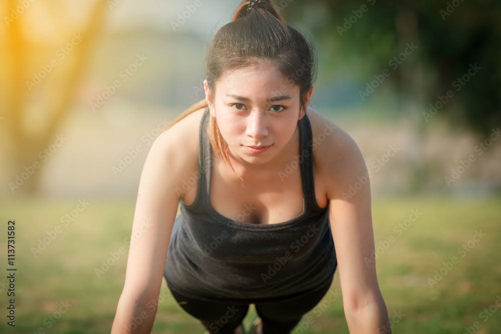 Athletic woman asian warming up and Young female athlete sitting