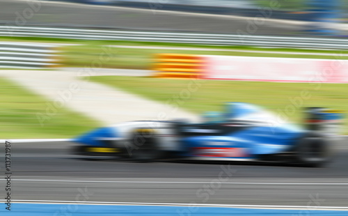 car racing on the road with motion blur and Radial blu © tuiphotoengineer