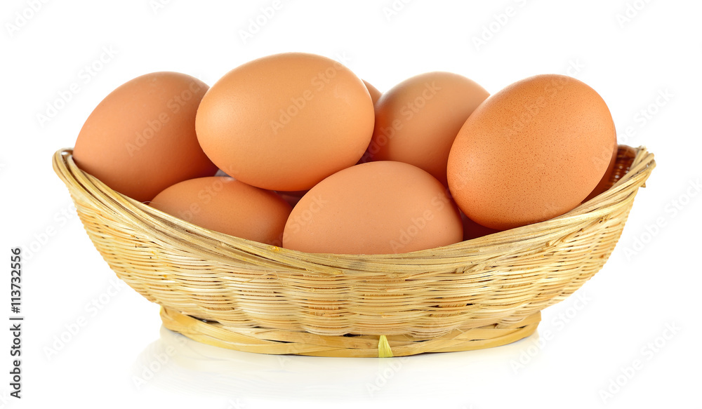 Brown eggs in the basket on white background Brown eggs in the basket on white background