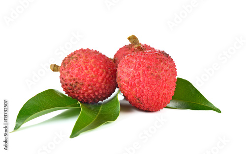 Sweet lychees fruits with leaves close up on white background