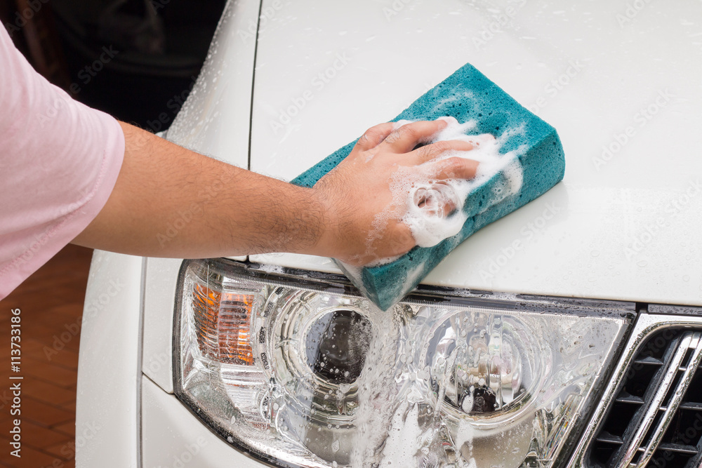 Hand car wash with soap.