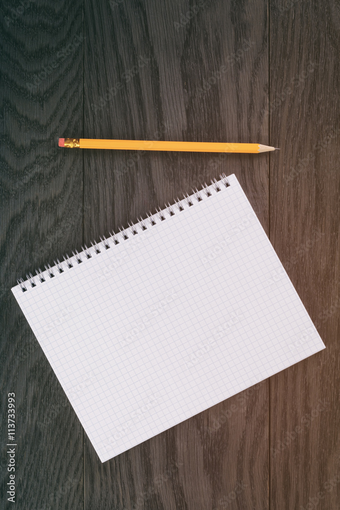 blank notepad on wood table blank notepad on wood table