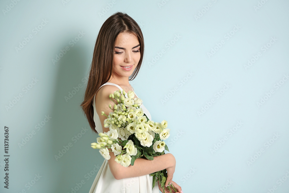 Beautiful young woman holding bouquet of white flowers on light background Beautiful young woman holding bouquet of white flowers on light background