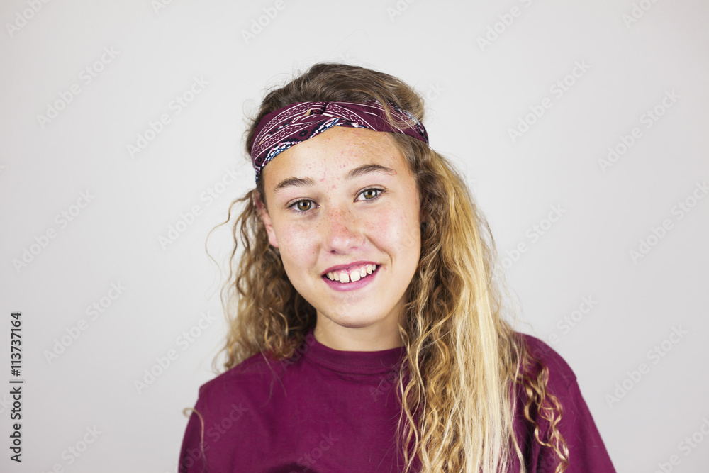 Close up portrait of smiling pretty teenager with curly hair and Close up portrait of smiling pretty teenager with curly hair and