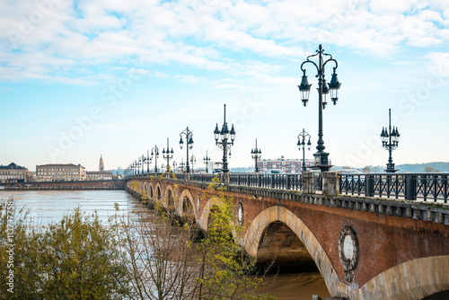Old stony bridge in Bordeaux, France Europe
