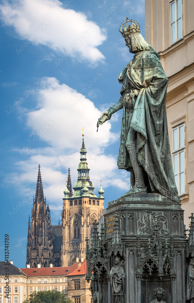 Prague, Czech Republic - May 28, 2016: King Charles IV monument at Crusaders' Square in Prague. St. Vitus cathedral at Prague castle in background. 