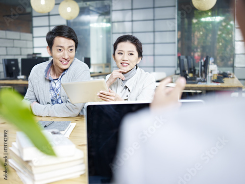 young business people talking in office