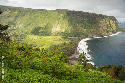 Waipio Valley with approaching bad weather. View taken from the lookout. The clouds already start rolling in from the opposite side of the valley.