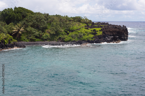 Small beach and black rocks at Waianapanapa State Park.