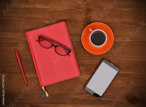 notepads, coffee cup and smartphone