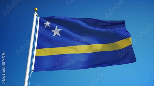 Curaçao flag waving in slow motion against blue sky, seamlessly looped, close up, isolated on alpha channel with black and white luminance matte, perfect for film, news, digital composition photo