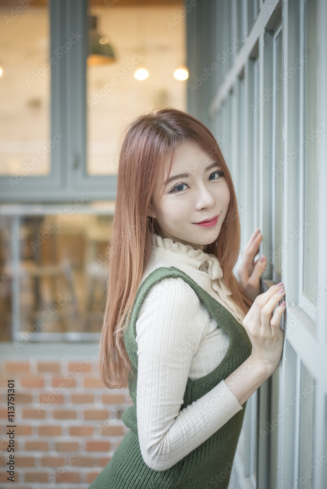 portrait of attractive asian girl in coffee shop