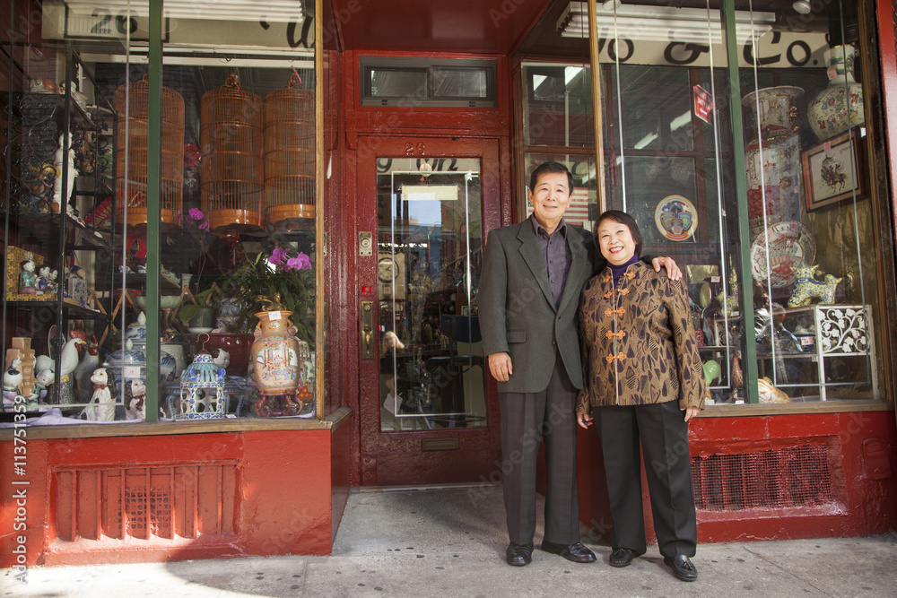 Asian family in front of store