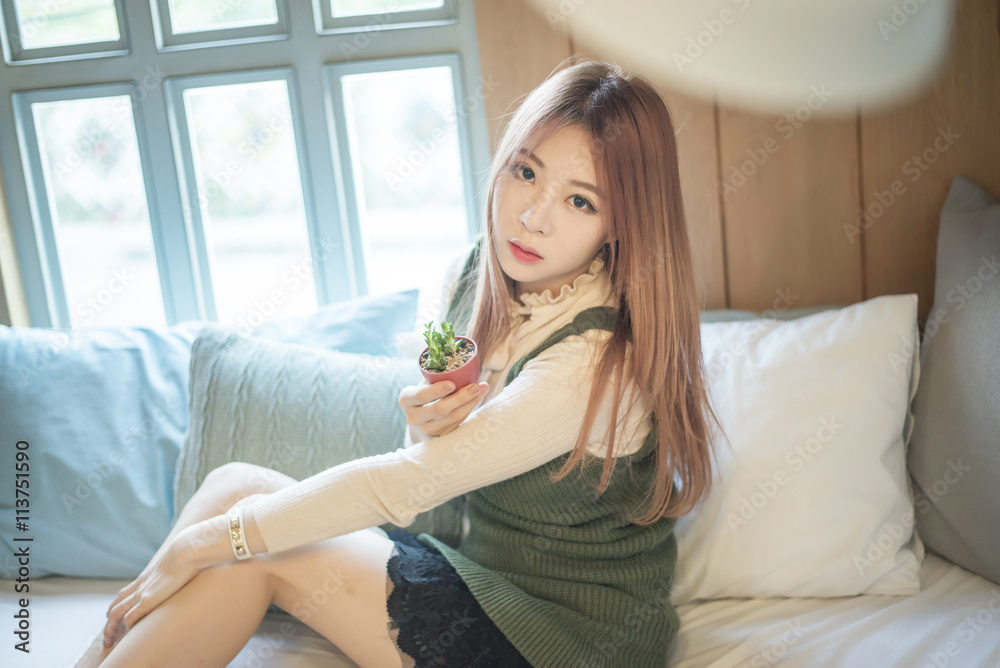 portrait of attractive asian girl in coffee shop portrait of attractive asian girl in coffee shop
