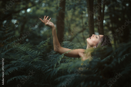Fotografie Beautiful nymph resting in a peaceful forest