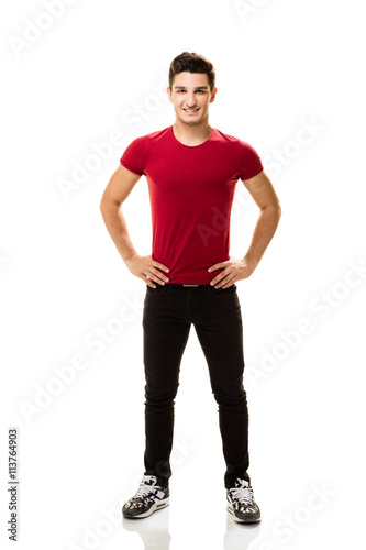 Teenage boy posing on white background.