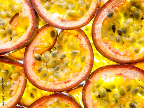 Obraz na plátně back lit slices of ripe maracuja passion fruit
