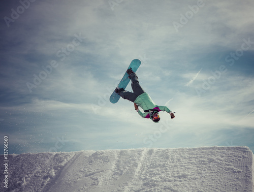 snowboarder jumps a superman backflip