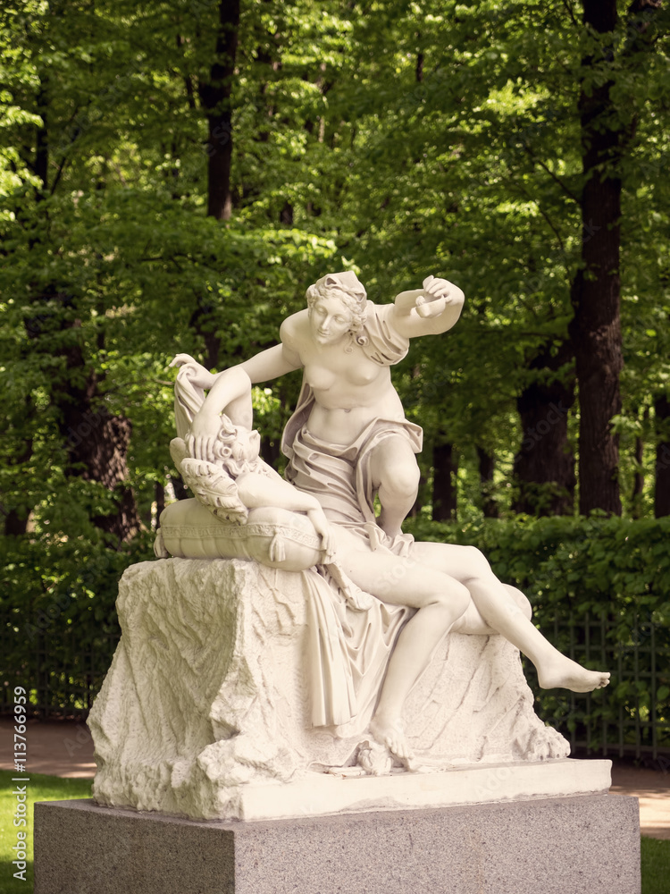 Statue in the summer park. Saint-Petersburg, Russia