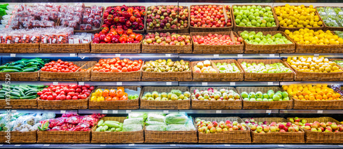 Fresh fruits and vegetables on shelf in supermarket