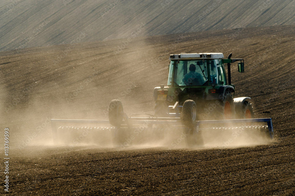 Fototapeta premium Agricultural tractor working