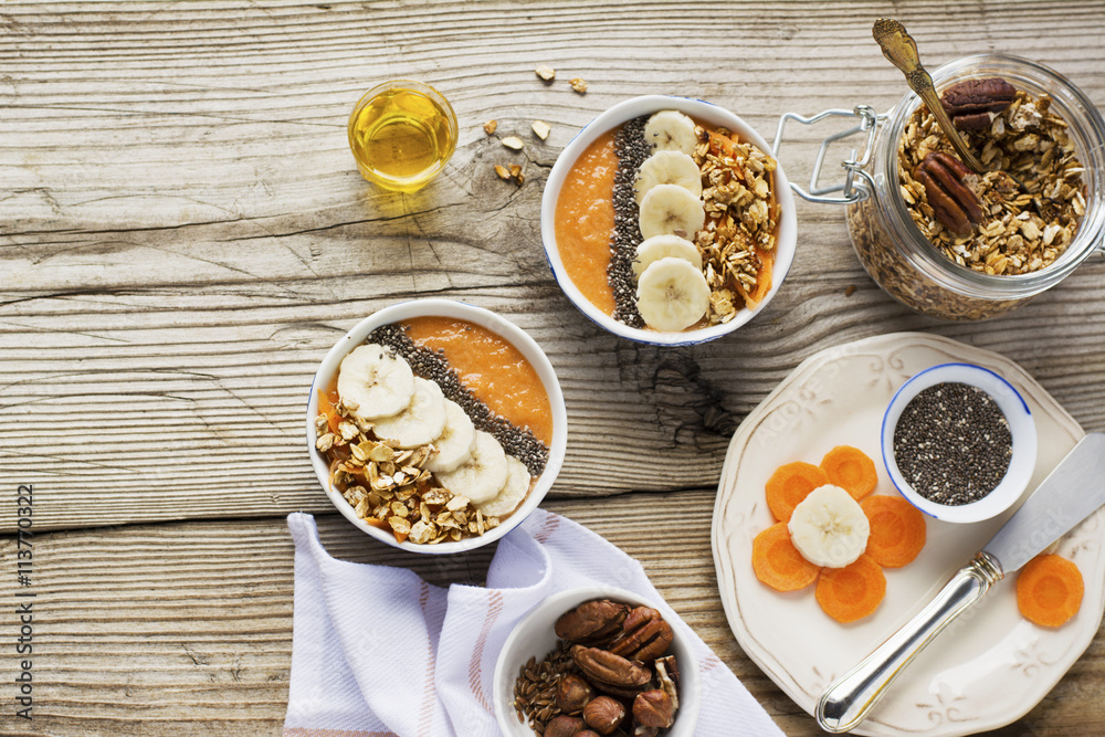 Healthy breakfast. Carrot Banana smoothie with granola and chia seeds Healthy breakfast. Carrot Banana smoothie with granola and chia seeds