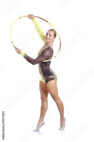 Beautiful artistic female gymnast working out, performing art gymnastics element © cirkoglu