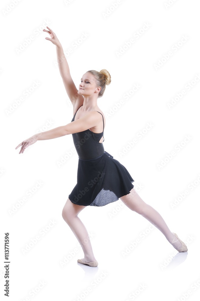 Beautiful artistic female ballerina working out, performing art ballet element