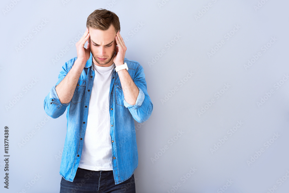 Moody man standing isolated on white background Moody man standing isolated on white background