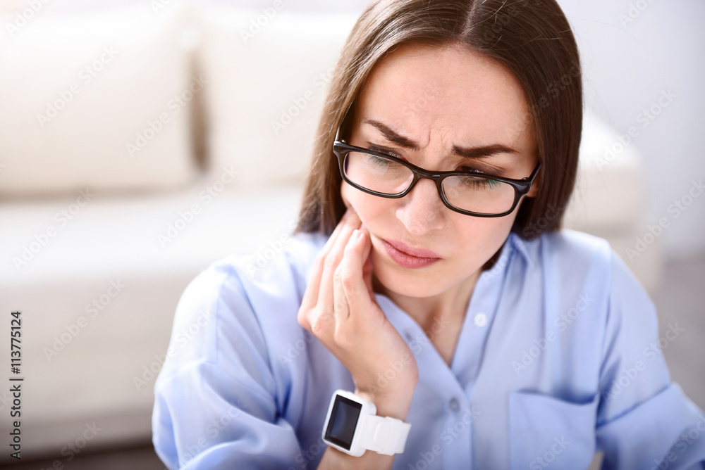 Sick woman having a tooth ache