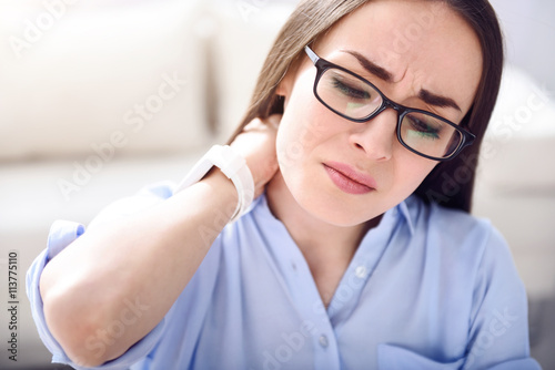Tired woman feeling pain
