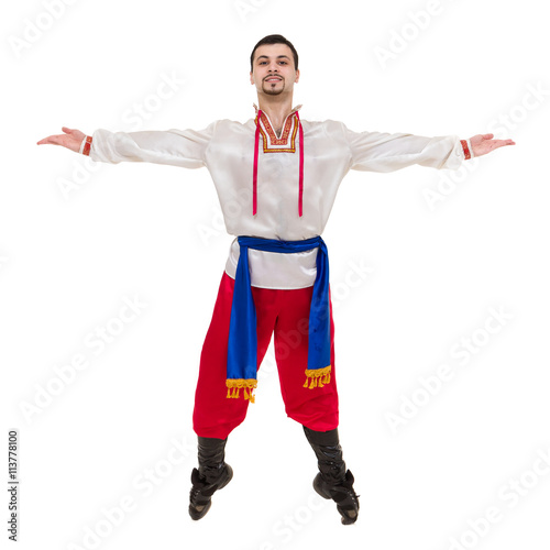 young man wearing a folk costume posing against isolated white with copyspace