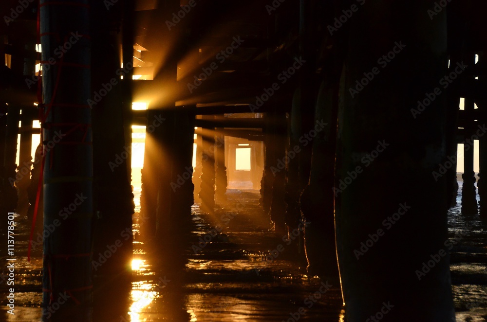 california sunset under a pier california sunset under a pier