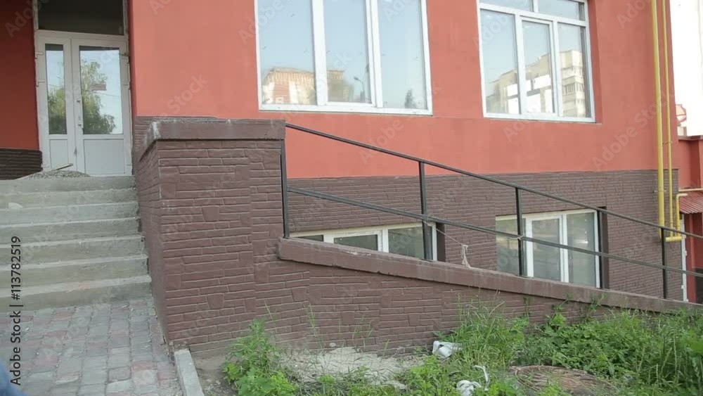 Handsome runner doing parkour. Jumping over stairs. Acrobatic getaway Handsome runner doing parkour. Jumping over stairs. Acrobatic getaway