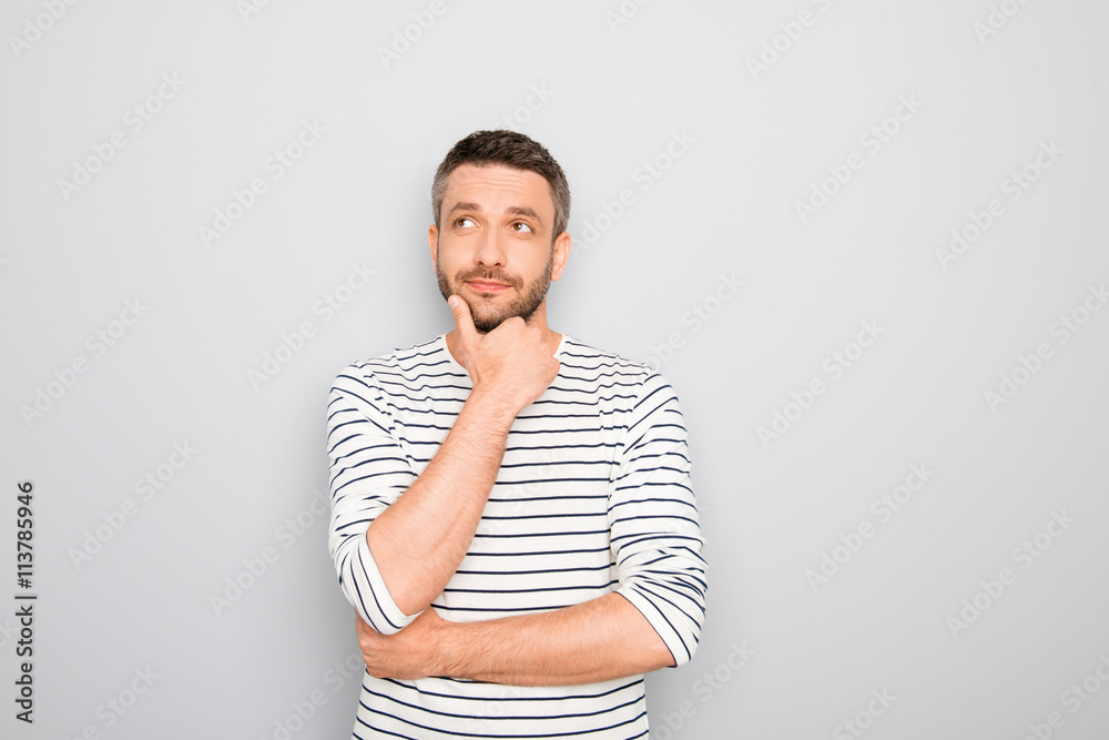 Successful thoughtful young businessman thinking about smth Successful thoughtful young businessman thinking about smth