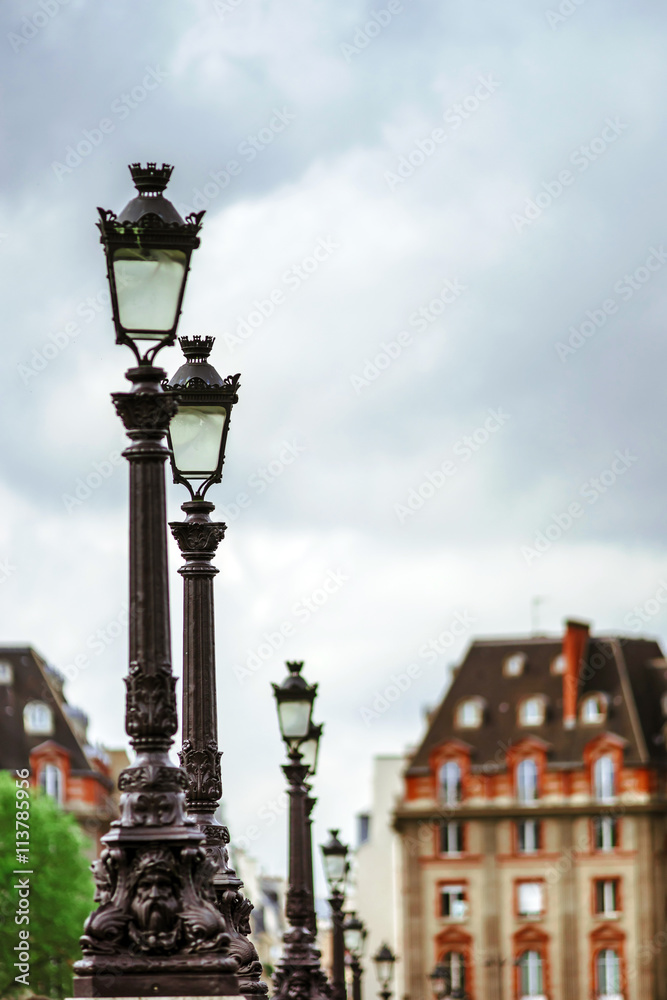 Line of street lamps in Paris, romantic city.