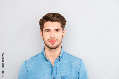 Portrait of handsome young successful businessman in blue shirt