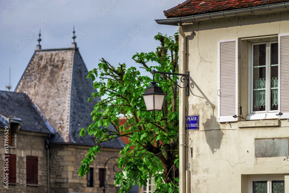 Typical french village street with retro-style lanterns