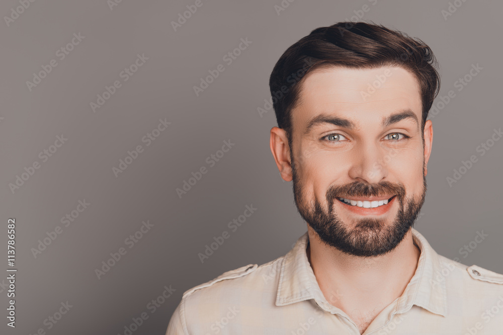 Handsome happy smiling man isolated on gray background Handsome happy smiling man isolated on gray background