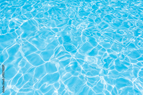 Water in swimming pool  Blue Water with sun reflection  Water effect with sun reflection in swimming pool