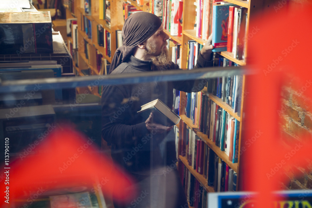 Person in books and antique store Person in books and antique store