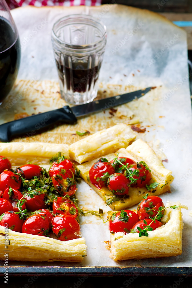 tart with cherry tomatoes and herbs