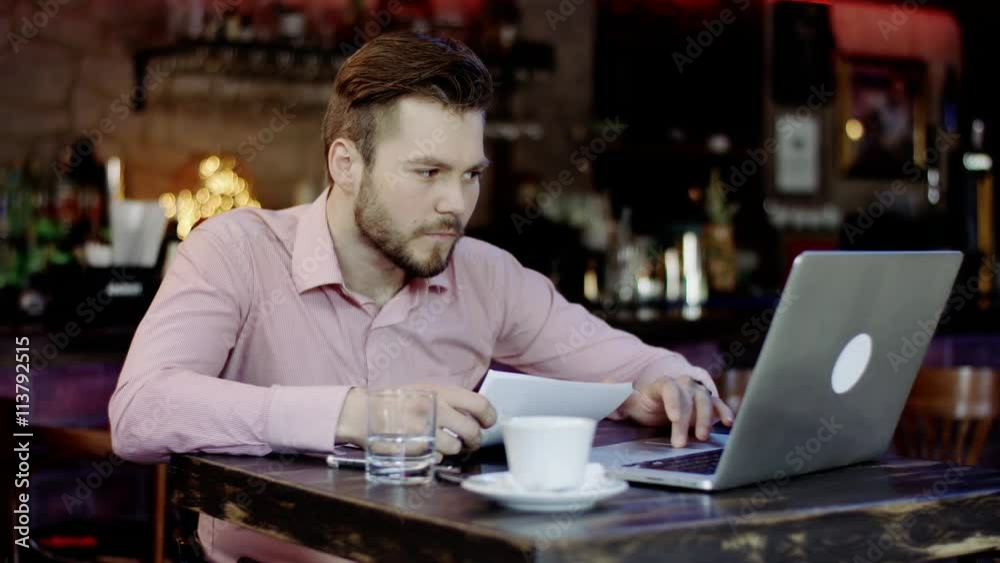 young business man has turned upset working in a bar young business man has turned upset working in a bar