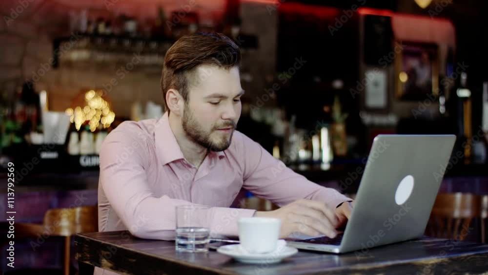 young business man has turned upset working in a bar young business man has turned upset working in a bar