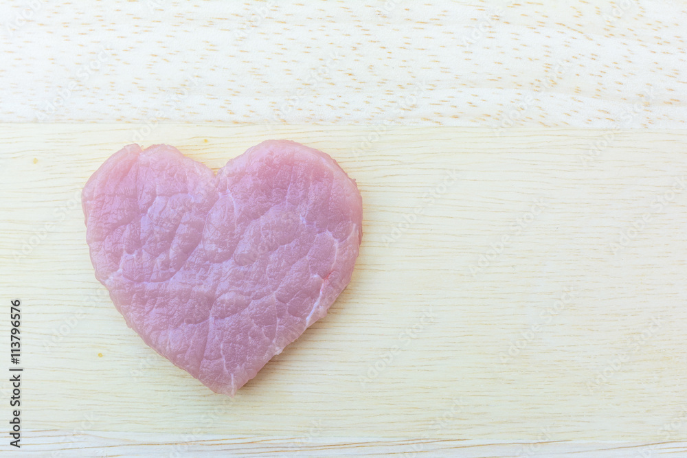 Fototapeta premium pork with heart shape on plate