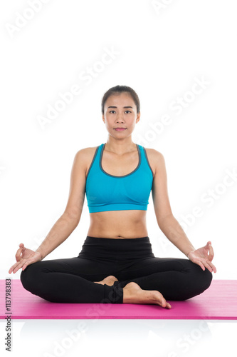 Yoga woman - pretty asian female in active wear doing yoga