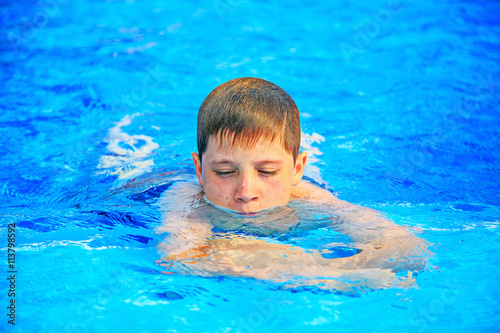 Children swimming in the pool © valentsova