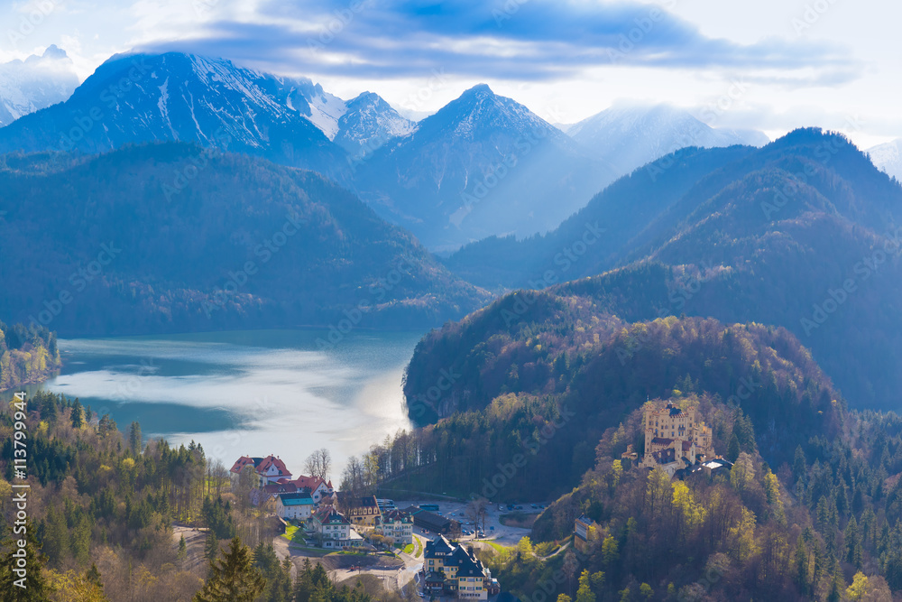 View from Neuschwanstein castle with Hohenschwangau castle, Alspee and Alps in the background, Southern Bavaria, Germany