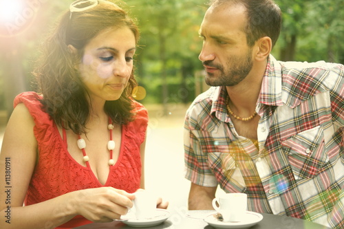 Couple having a cofee in the park
