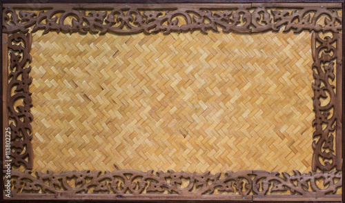Carved wooden frame and Bamboo wood background.